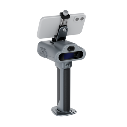 A hand-held gray laser scanner, shown with a smartphone mounted on top for display, facing forward.