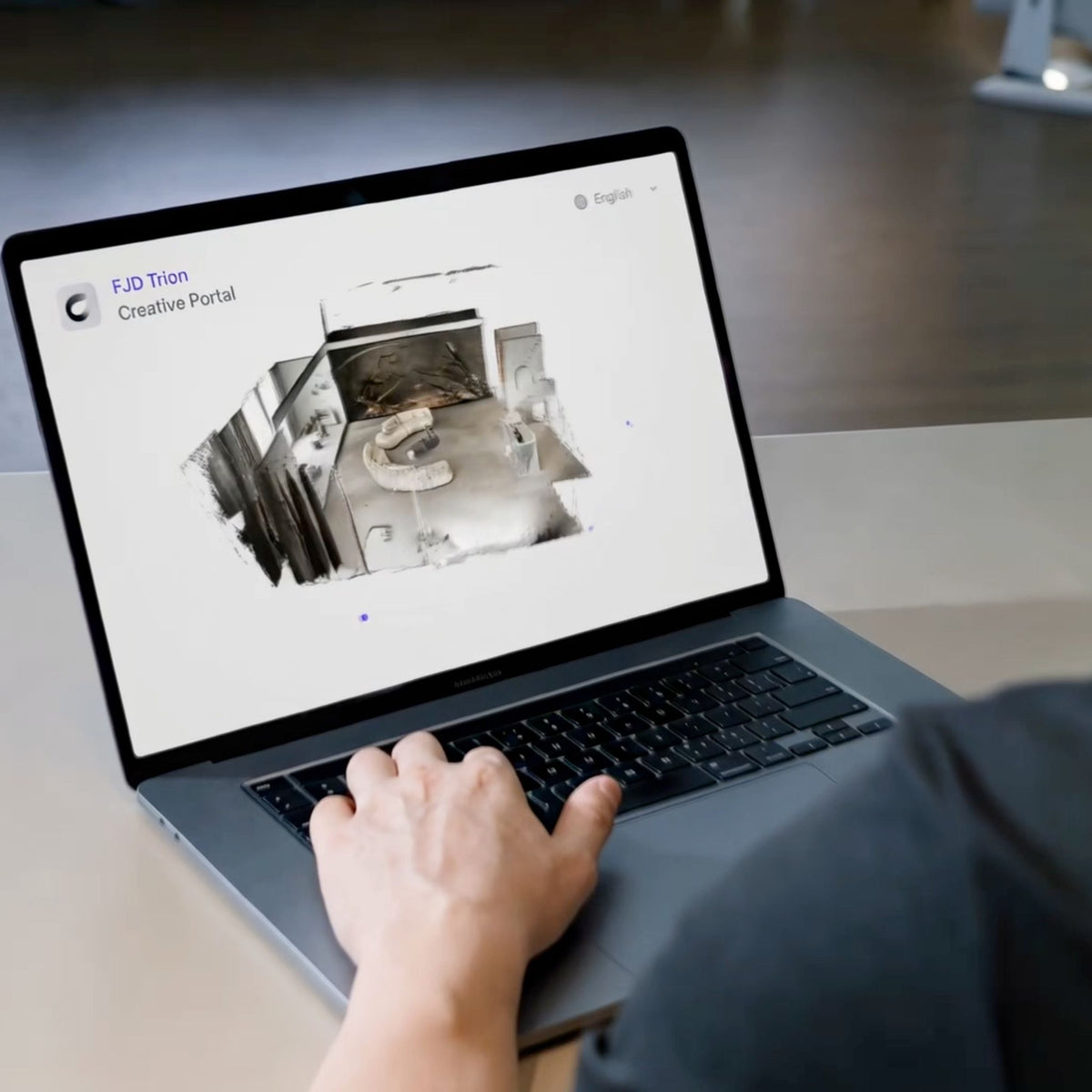 Person using Creative Portal on a laptop displaying a 3D point cloud scan of an interior room